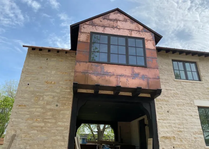 Copper metal panel facade on a stone building for Skylight Installation in North Palm Beach