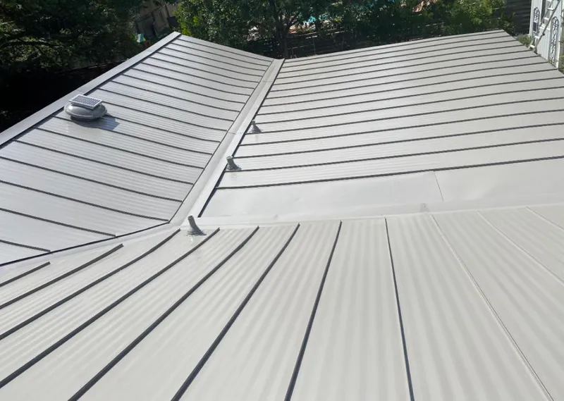 Solar attic fan installed on a metal roof for Roof Ventilation in North Palm Beach